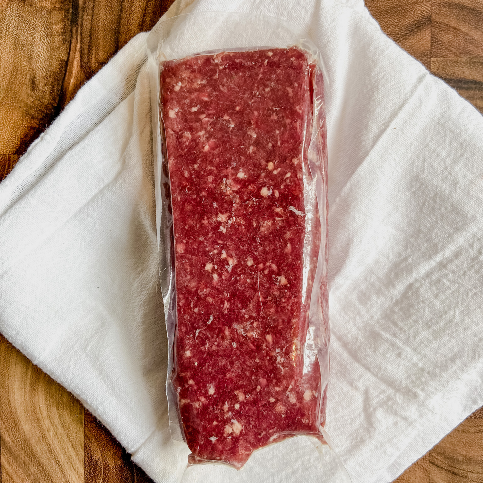 One pound of frozen farm raised goat meat for sale.