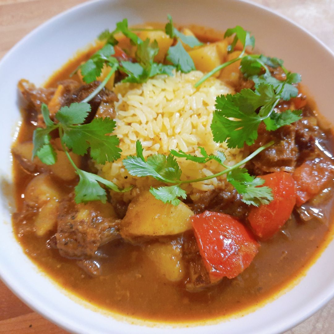 bowl of curried goat stew 