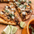 goat birria pizza on cutting board with lime